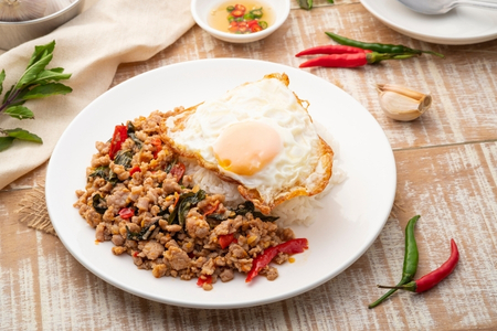 Thai Pad Kra Pao with minced meat, steamed rice, and fried egg